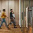 Group of office people walking at office open space. Team of business employees at coworking center. People at motion blur. Concept working at action
